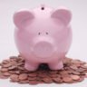 Piggy bank on pennies representing savings accounts and CD yields